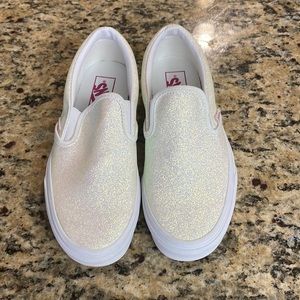 NWOB pair of white sparkle Vans shoe size 8.5 women or 7 in men.